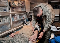 Senior Airman Robert Moon, 5th Medical Operations Squadron aerospace medical technician, applies a blood pressure cuff on a simulated patient at Minot Air Force Base, N.D., Dec. 1, 2016. Ambulance services Airmen obtain and record patients’ vital signs to include blood pressure, respirations, pulse, oxygen saturation, weight and height.  (U.S. Air Force photo/Airman 1st Class Jonathan McElderry)