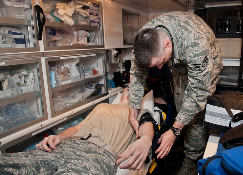Senior Airman Robert Moon, 5th Medical Operations Squadron aerospace medical technician, applies a blood pressure cuff on a simulated patient at Minot Air Force Base, N.D., Dec. 1, 2016. Ambulance services Airmen obtain and record patients’ vital signs to include blood pressure, respirations, pulse, oxygen saturation, weight and height.  (U.S. Air Force photo/Airman 1st Class Jonathan McElderry)