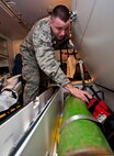 Senior Airman Robert Moon, 5th Medical Operations Squadron aerospace medical technician, inspects an oxygen tank at Minot Air Force Base, N.D., Dec. 1, 2016. Oxygen tanks are used to sustain oxygen for patients while being transported to hospitals. (U.S. Air Force photo/Airman 1st Class Jonathan McElderry)