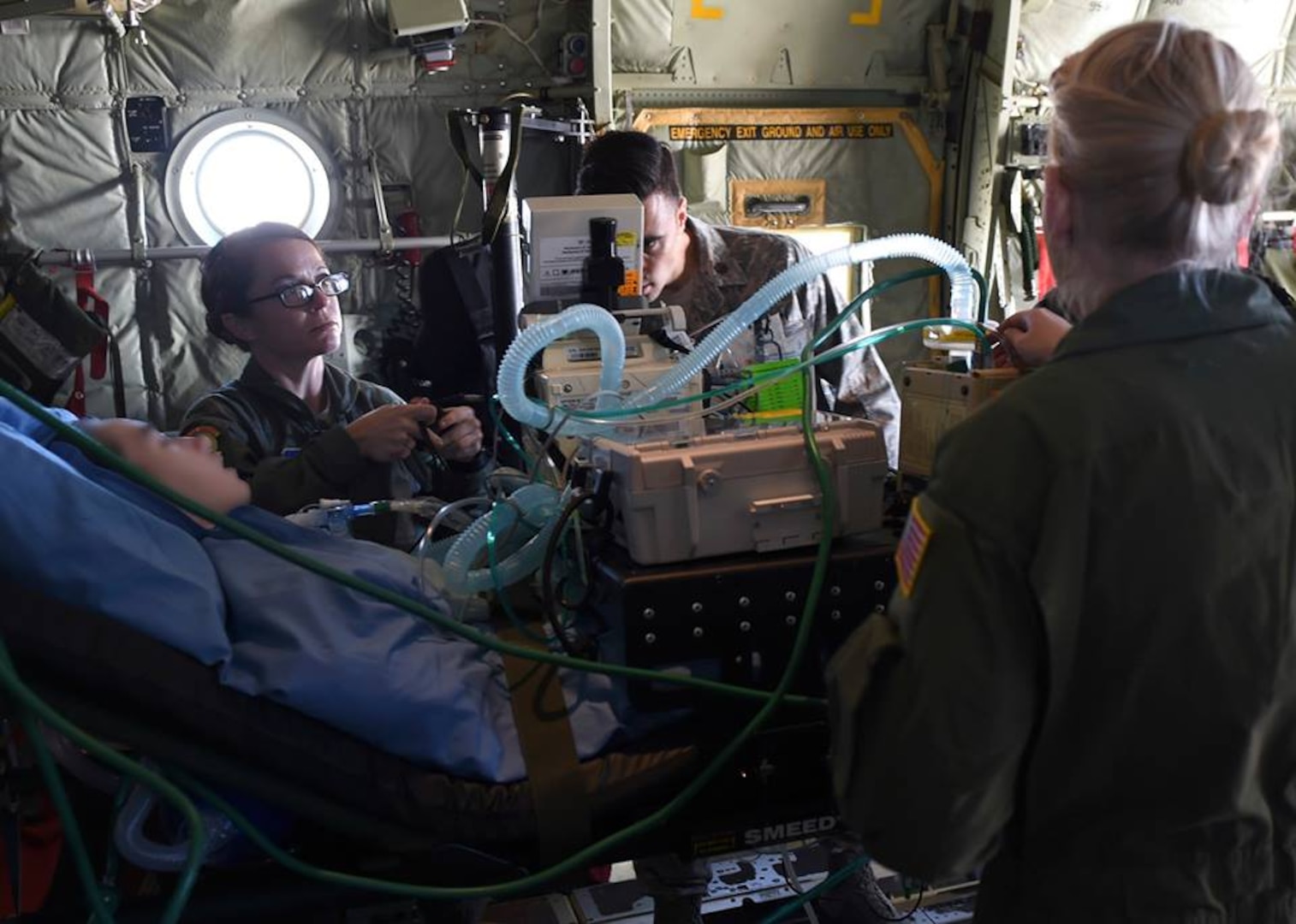 2nd Lt. Andrea Perez, Maj. Jeffrey DellaVolpe, and Staff Sgt. Cynthia Thurman, members of the 59th Medical Wing Acute Lung Rescue Transport team, tends to a patient while onboard an ambulance on Kelly Field Annex, San Antonio, Dec. 12, 2016. A unique 59th Medical Wing capability, the ECMO transport program began at Wilford Hall Medical Center in the 1990s. (U.S. Air Force photo/Staff Sgt. Jason Huddleston)