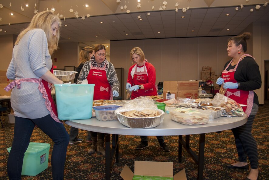 The Team Osan Spouse’s Club and volunteers sort and bag cookies for Operation Sweet Treat 2016 on Osan Air Base, Republic of Korea, Dec. 13, 2016. Operation Sweet Treat provided 8422 bags of sweet treats to unaccompanied  soldiers and Airmen on the Korea peninsula. (U.S. Air Force photo by Staff Sgt. Jonathan Steffen)
