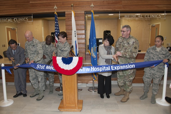 Representatives from Seohee Construction Company, the 51st Fighter Wing and Army Corps of Engineers Far East District cut a ribbon during the 51st Medical Group Phase One Hospital Expansion ribbon-cutting ceremony on Osan Air Base, Republic of Korea, Dec. 12, 2016. Phase one of the expansion included new clinics for family health, women’s health, pediatrics, and education and training . (U.S. Air Force photo by Staff Sgt. Jonathan Steffen)