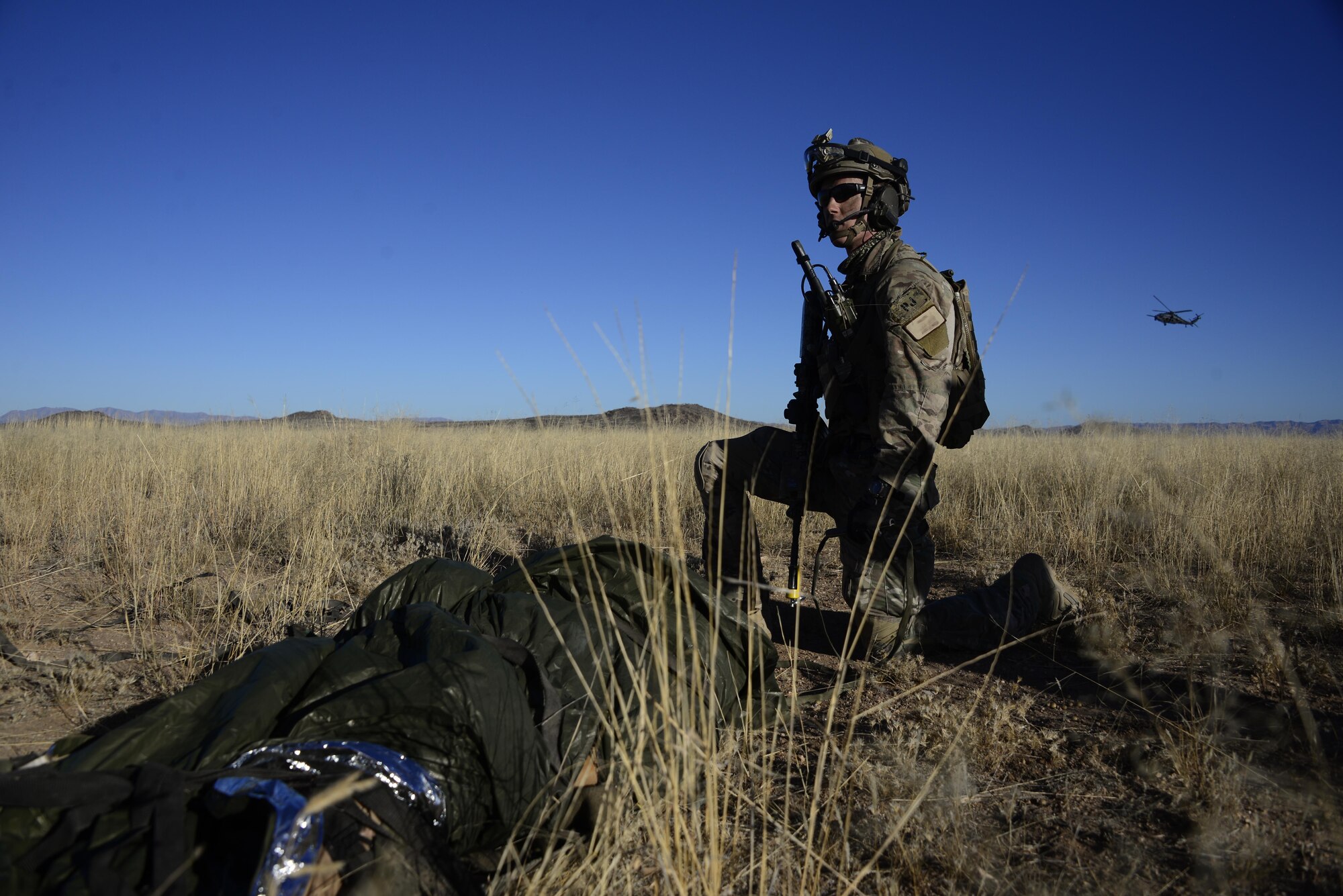 A U.S. Air Force pararescueman from the 48th Rescue Squadron provides overwatch during a mass casualty exercise at Fort Huachuca, Ariz., Dec. 8, 2016. During the exercise, pararescuemen were expected to triage, treat and evacuate casualties, and to eliminate any presence of simulated opposing forces. (U.S. Air Force photo by Senior Airman Betty R. Chevalier)