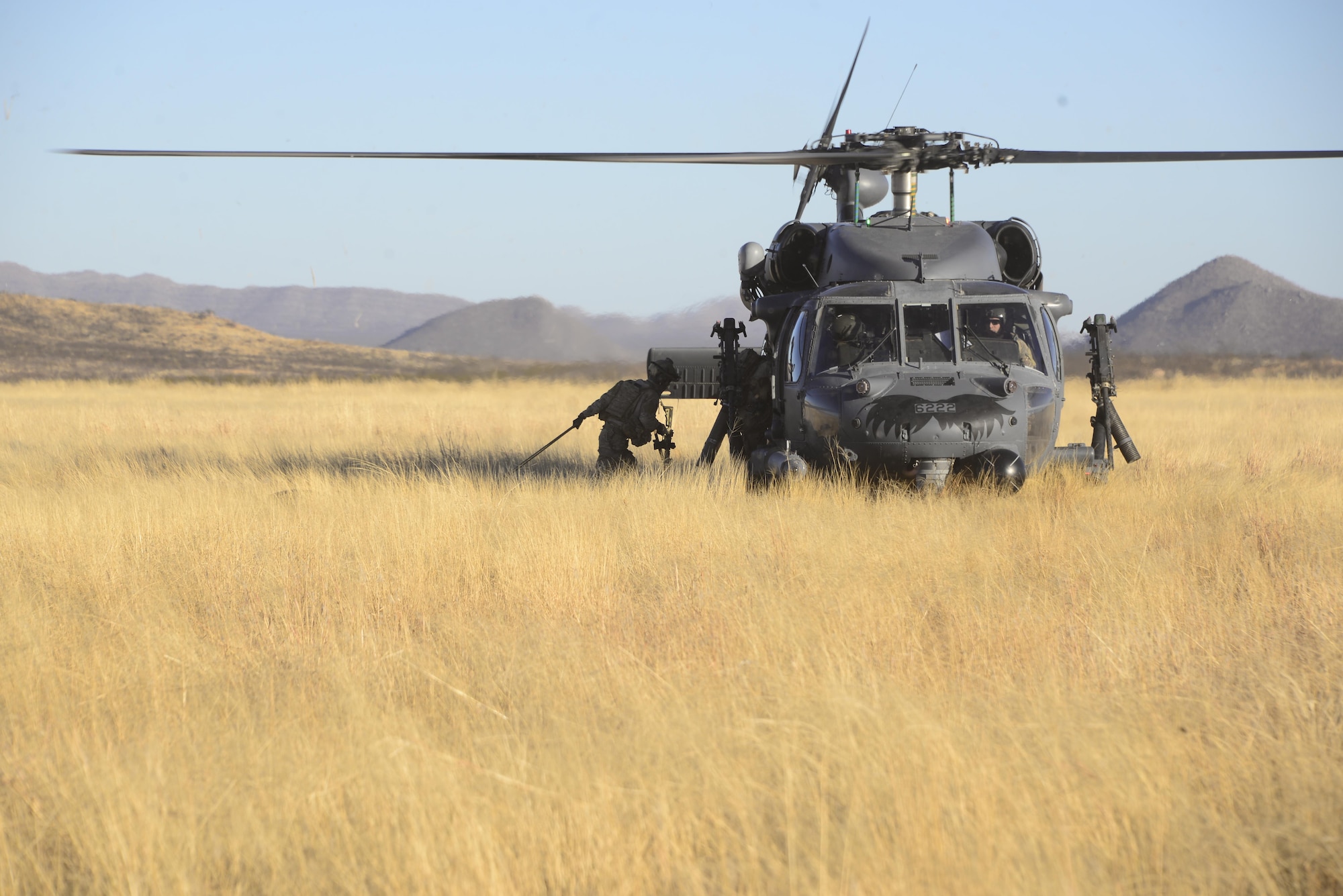 U.S. Air Force pararescuemen assigned to the 48th Rescue Squadron load simulated casualties onto an HH-60G Pave Hawk assigned to the 55th Rescue Squadron during a mass casualty exercise at Fort Huachuca, Ariz., Dec. 8, 2016. Pararescuemen were air dropped into the site of a simulated plane crash, where they triaged casualties and had them airlifted from the site. (U.S. Air Force photo by Senior Airman Betty R. Chevalier)