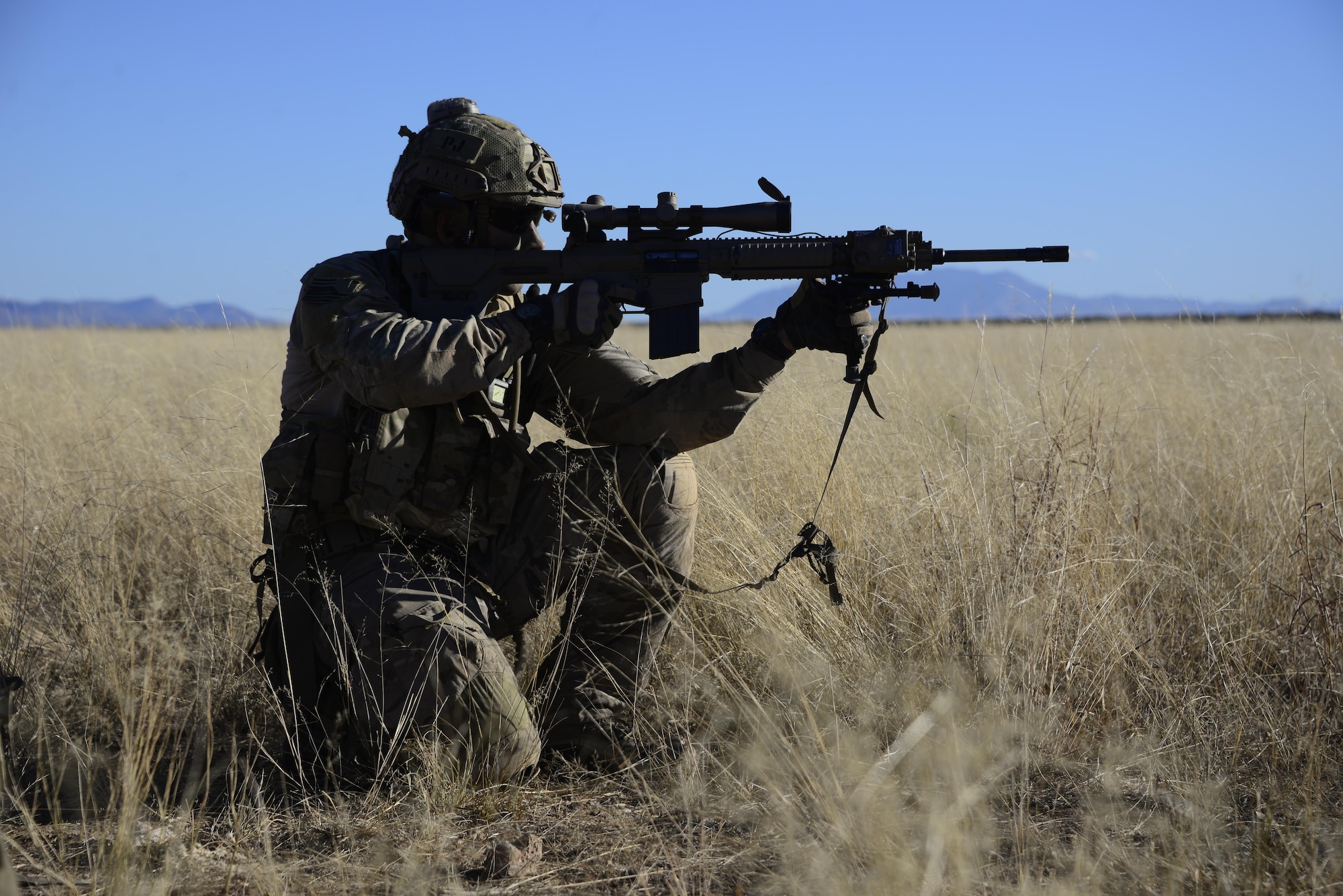 A U.S. Air Force pararescueman from the 48th Rescue Squadron fires a blank round toward simulated opposing forces during a mass casualty exercise at Fort Huachuca, Ariz., Dec. 8, 2016. During the exercise, pararescuemen were expected to triage, treat and evacuate casualties, and to eliminate any presence of simulated opposing forces. (U.S. Air Force photo by Senior Airman Betty R. Chevalier)