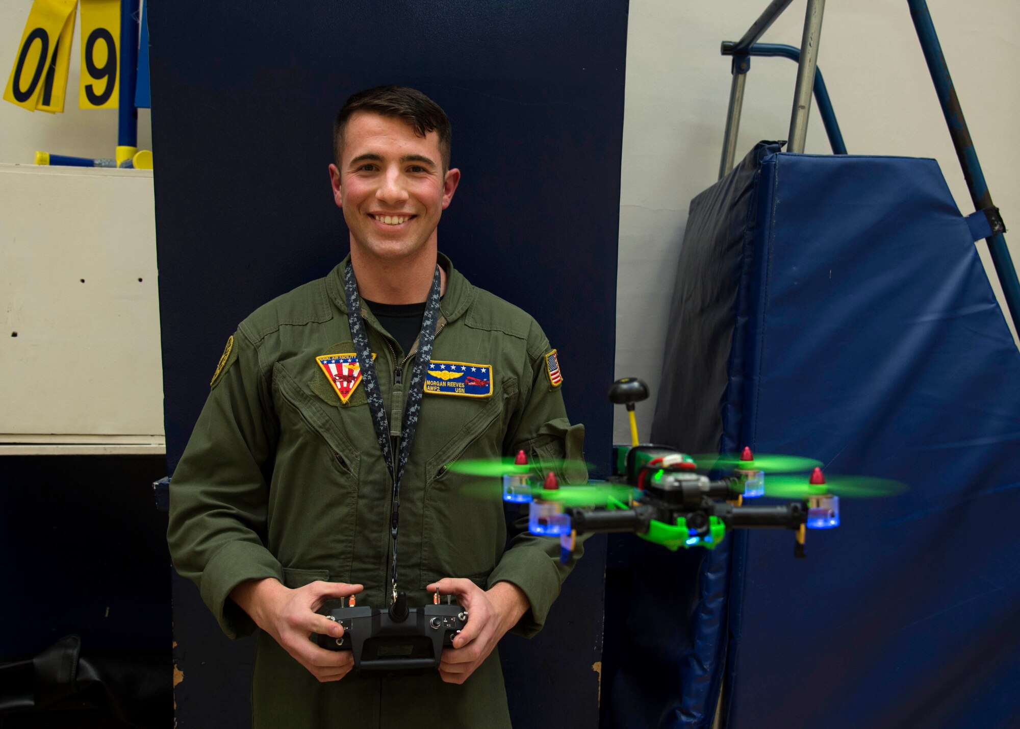 U.S. Navy Petty Officer 2nd Class Morgan Reeves, Naval Air Facility Misawa UC-12F Huron crewman, poses for a photo after a drone safety symposium at Misawa Air Base, Japan, Dec. 8, 2016. Reeves’ long passion of flying drones drove him to teach the importance of safety to children during the symposium. (U.S. Air Force photo by Senior Airman Deana Heitzman)
