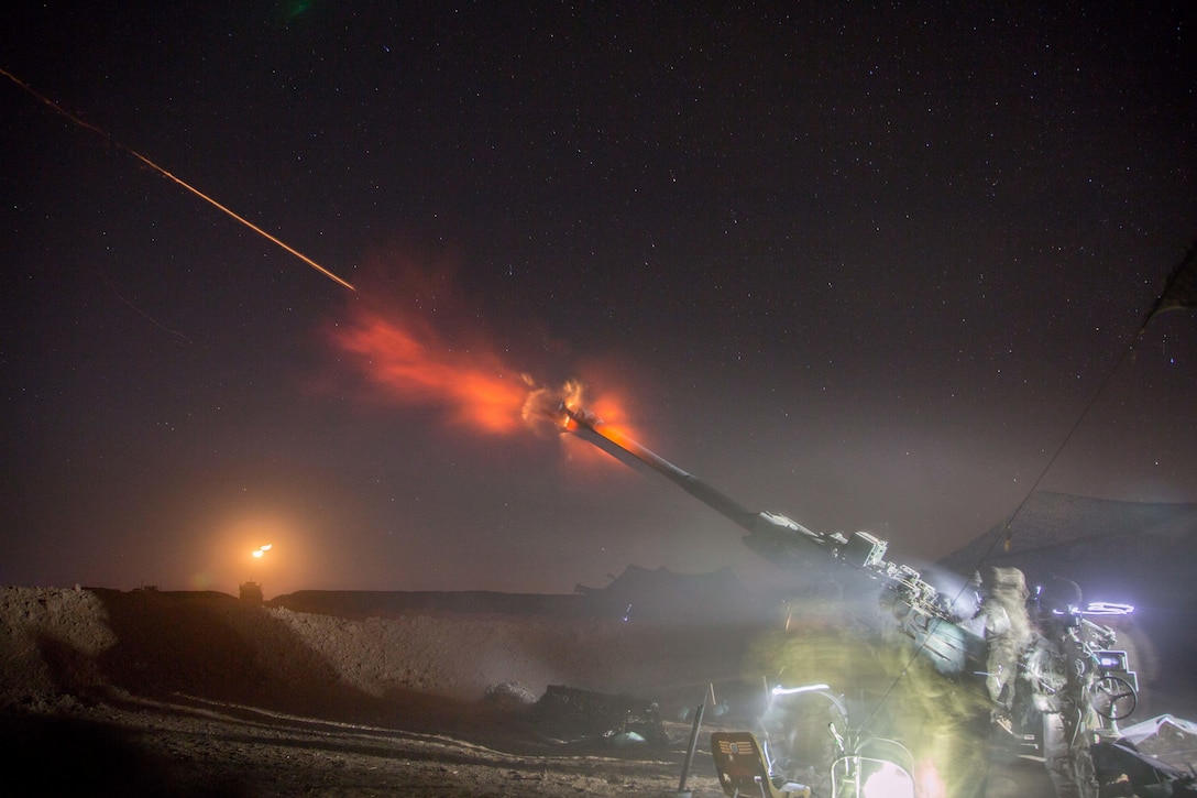 U.S. Soldiers assigned to Charlie Battery, 1st Battalion, 320th Field Artillery Regiment, 2nd Brigade Combat Team, 101st Airborne Division conduct a night fire mission in support of the Mosul offensive at Platoon Assembly Area 14, Iraq, Dec. 6, 2016. Charlie Battery conducted the fire mission in support of Combined Joint Task Force - Operation Inherent Resolve, the global Coalition to defeat ISIL in Iraq and Syria.  (U.S. Army photo by Spc. Christopher Brecht)