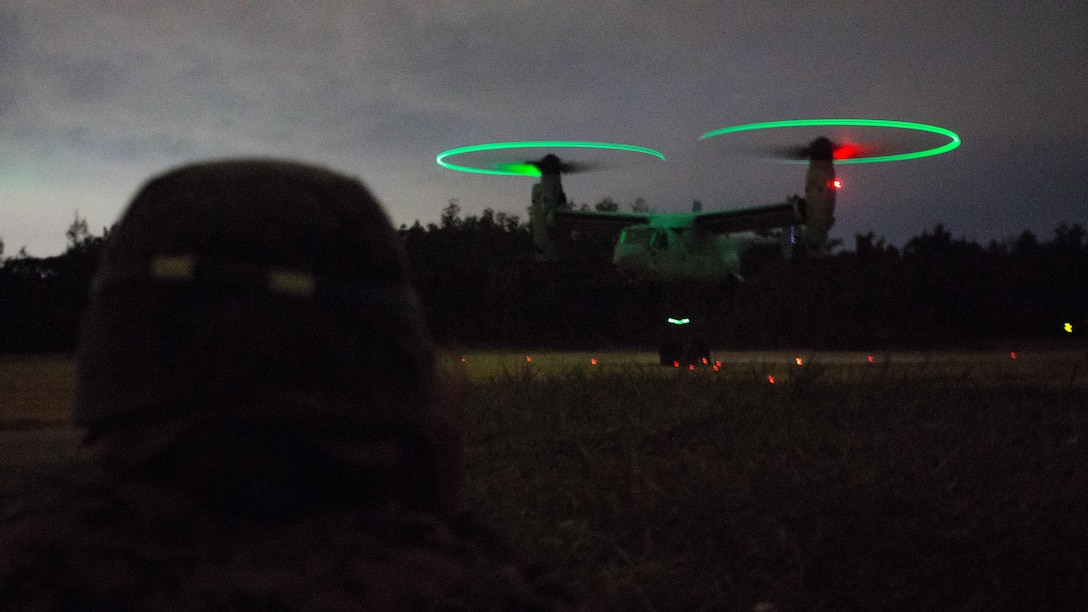 1st Lt. Laura Derouin, platoon commander, Landing Support Platoon, Combat Logistics Battalion 31, 31st Marine Expeditionary Unit, observes landing support specialists connect a load to a MV-22B Osprey tiltrotor aircraft from Marine Medium Tiltrotor Squadron 262 (Reinforced), 31st MEU, as part of external lift operations training at Landing Zone Falcon, Okinawa, Japan, Dec. 8, 2016. The units conducted the training to complete qualifications for the 31st MEU's upcoming spring deployment. As the Marine Corps' only continuously forward-deployed unit, the 31st MEU air-ground-logistics team provides a flexible force, ready to perform a wide range of military operations, from limited combat to humanitarian assistance operations, throughout the Indo-Asia-Pacific region. 