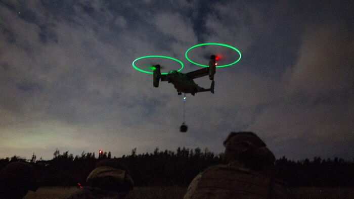 Marines assigned to Landing Support Platoon, Combat Logistics Battalion 31, 31st Marine Expeditionary Unit, observe a MV-22B Osprey tiltrotor aircraft from Marine Medium Tiltrotor Squadron 262 (Reinforced), 31st MEU, during external lift operations training at Landing Zone Falcon, Okinawa, Japan, Dec. 8, 2016. The units conducted the training to complete qualifications for the 31st MEU's upcoming spring deployment. As the Marine Corps' only continuously forward-deployed unit, the 31st MEU’s air-ground-logistics team provides a flexible force, ready to perform a wide range of military operations, from limited combat to humanitarian assistance operations, throughout the Indo-Asia-Pacific region. 
