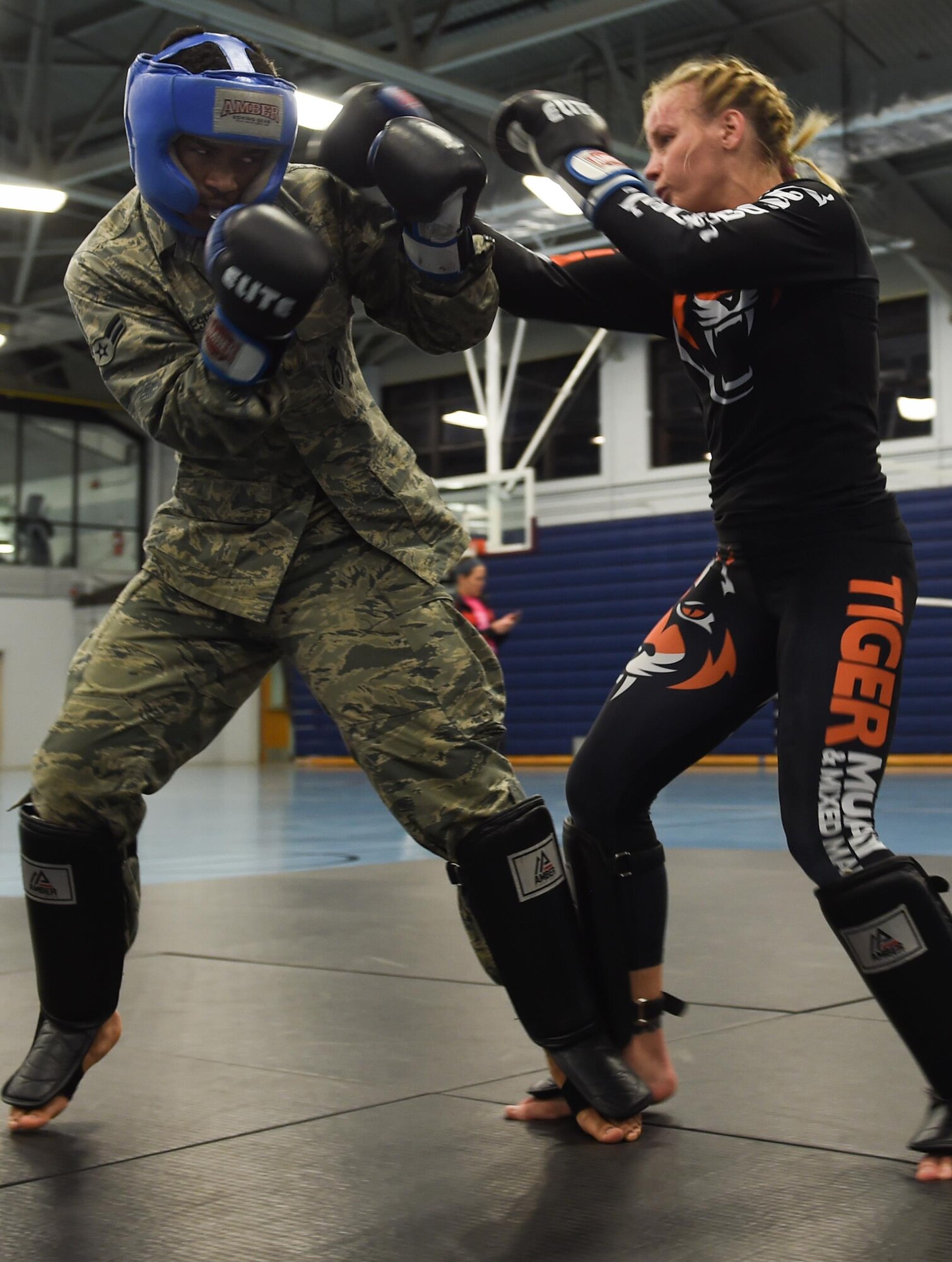 U.S. Air Force Airman 1st Class Ramon Crespo, 633rd Security Forces Squadron entry control point monitor, spars with Valentina Shevchenko, UFC Bantamweight fighter, at Joint Base Langley-Eustis, Va., Dec. 8, 2016. Schevchenko visited the installation along with UFC fighters, Ben Rothwell and Lorenz Larkin as well as MMAradio hosts and Jacob ‘Stitch’ Durand. (U.S. Air Force photo by Staff Sgt. Natasha Stannard)