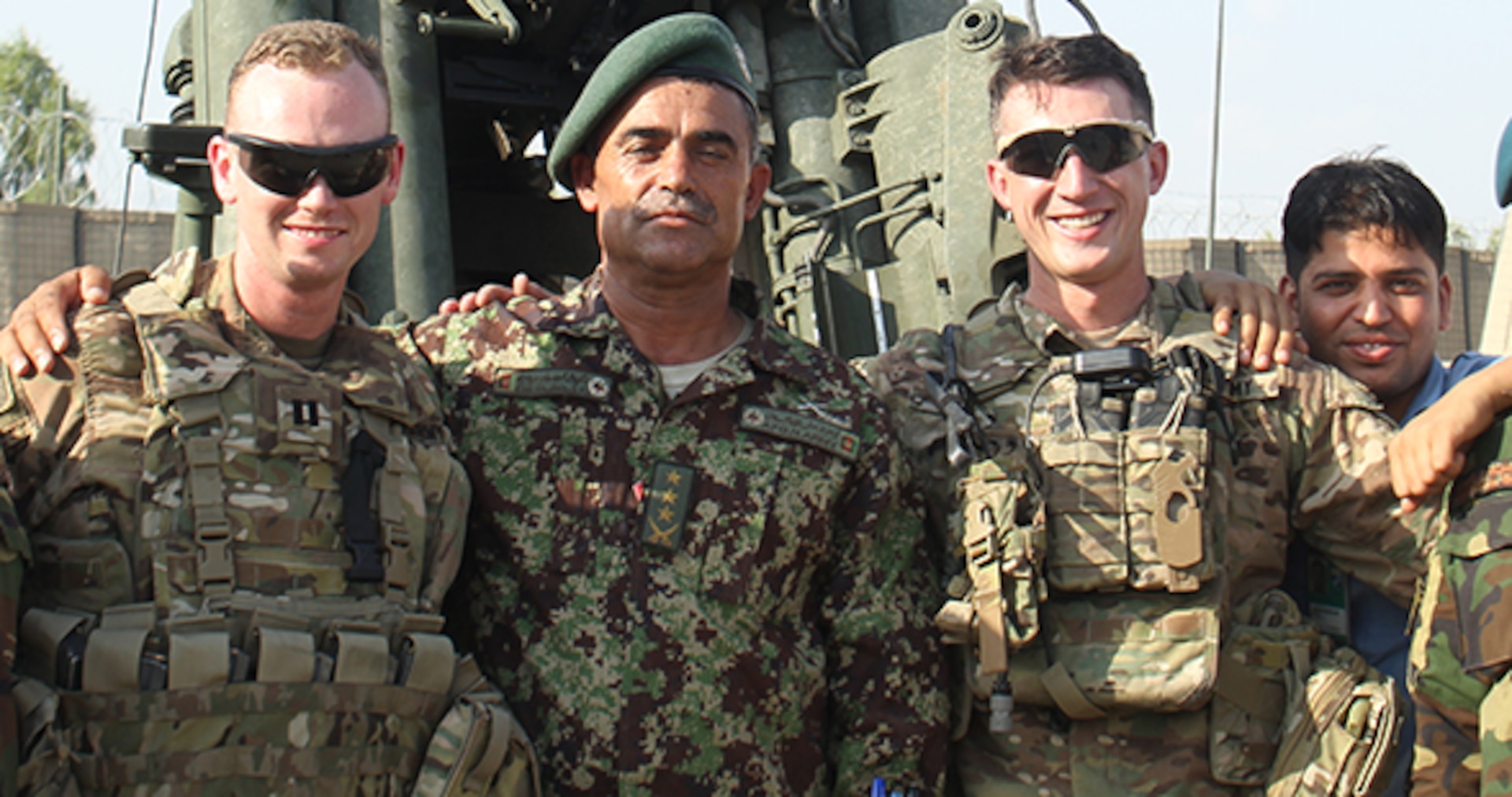 Capt. Dennis M. Kelly, a fire support advisor with Train, Advise, Assist Command – East takes a moment to pose with Col. Ahmed Jan, fire support officer, 201st Corps. The two have a special bond that's helped lead to especially-effective artillery and air support in Afghanistan's eastern provinces. (U.S. Army Photo by Capt. Grace Geiger)