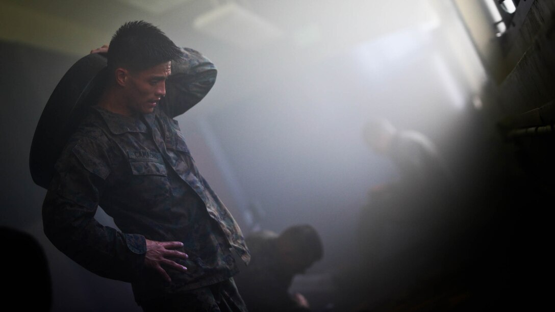 Marines assigned to Martial Arts Instructor Course Class 1-17, School of Infantry West, Detachment Hawaii, conduct physical training during the MAIC at building 222, at Marine Corps Base Hawaii, Dec. 13, 2016. The MAIC is a three week long course that puts applicants through rigorous training designed to instill teamwork and develop leadership abilities necessary for a Marine Corps Martial Arts Program instructor to teach classes. 