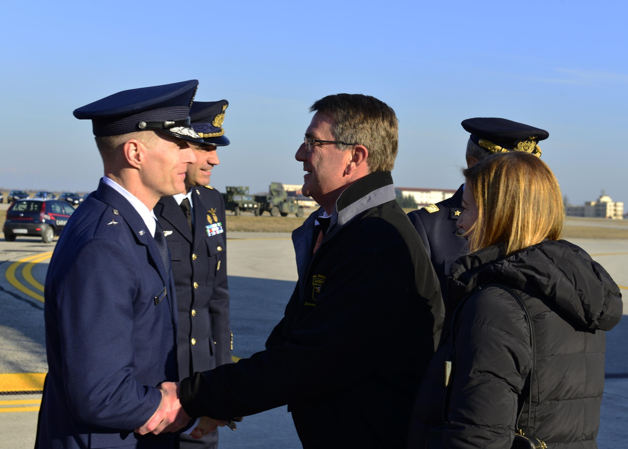 Brig. Gen. Lance Landrum, 31st Fighter Wing commander, welcomes Secretary of Defense Ash Carter to Aviano Air Base, Italy on Dec. 13, 2016. Carter visited Team Aviano during his holiday tour to Department of Defense installations around the world. (U.S. Air Force photo by Senior Airman Cary Smith)