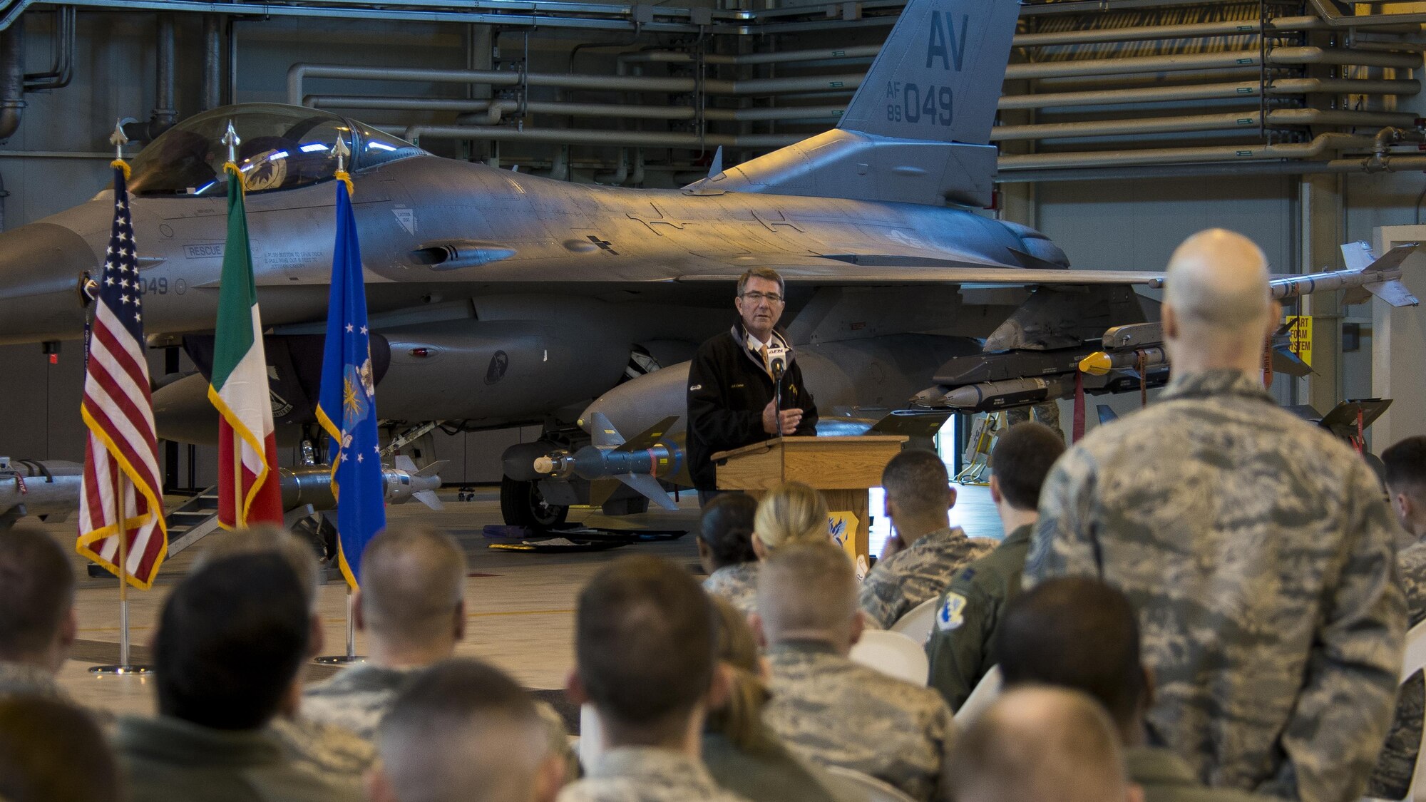 Secretary of Defense Ash Carter speaks to Team Aviano members during a visit to Aviano Air Base, Italy on Dec. 13, 2016. Carter thanked Team Aviano for their service, discussed current Operation Inherent Resolve activity, and answered questions from the crowd. (U.S. Air Force photo by Senior Airman Cory W. Bush)