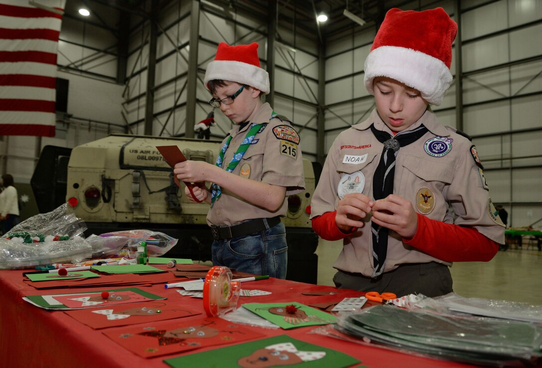 Children from Cub Scout pack 215 create holiday cards during the annual Children’s Holiday Party Dec. 10, 2016, on RAF Mildenhall, England. The Hearts Apart event and holiday party provided Team Mildenhall families an opportunity to come together in celebration of the holiday season through games, food and crafts. They had more than 800 people in attendance – largest number of attendees in event’s history. (U.S. Air Force photo by Senior Airman Christine Halan)