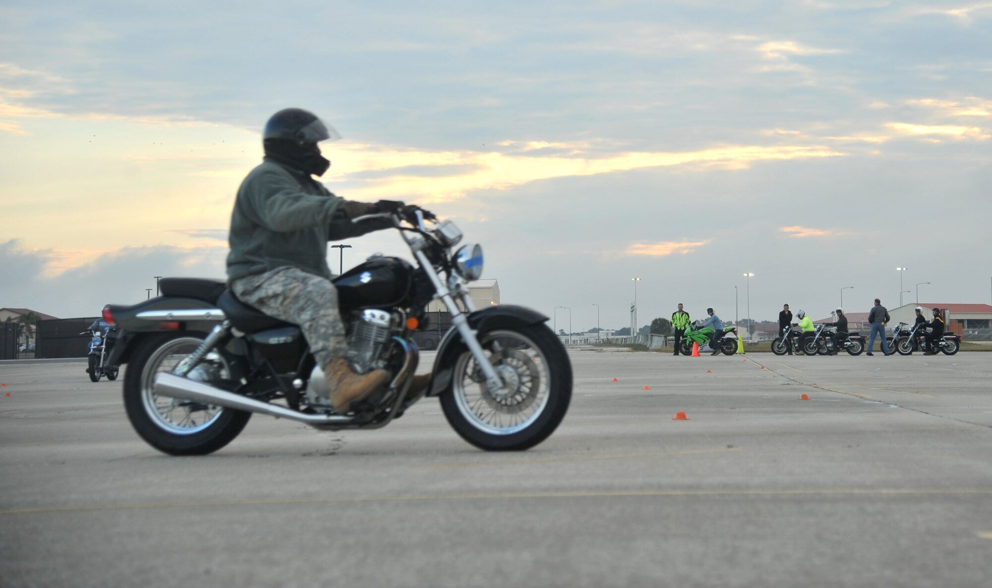 A member of Team MacDill rides a motorcycle through the training course, Dec. 8, 2016, at MacDill Air Force Base, Fla. After classroom instruction, students were allowed to go to the course range and practice some hands-on skills riding a motorcycle. (U.S. Air Force photo by Airman 1st Class Rito Smith) 

