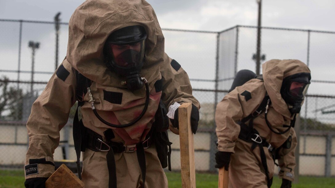 U.S. Marines with Chemical, Biological, Radiological and Nuclear Response Element from Headquarters Battalion, 3rd Marine Division, III Marine Expeditionary Force set up a decontamination site following a simulated chemical spill on Camp McTureous, Okinawa, Japan, Dec. 13, 2016, as a part of exercise Constant Vigilance. Constant Vigilance is an annual Marine Corps Installations Pacific exercise designed to validate and refine incident response procedures and train personnel on actions required in the event of a natural disaster. 