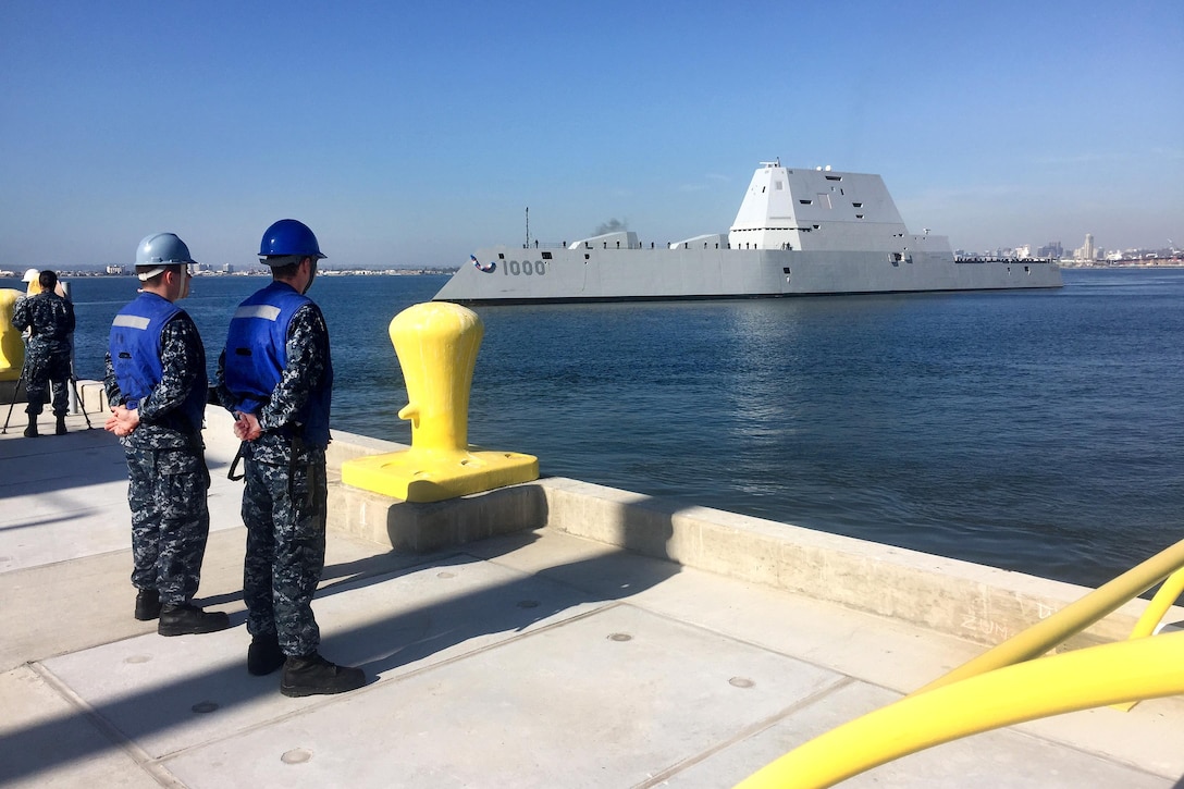 Sailors watch as the Navy's most technologically advanced surface ship, USS Zumwalt, steams through San Diego Bay en route to its new home port in San Diego, Dec. 8, 2016. Navy photo by Petty Officer 2nd Class Zachary Bell 