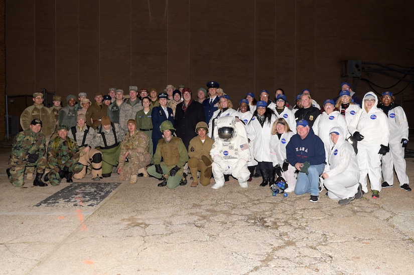 Joint Base Langley-Eustis and NASA Langley Research Center members pose for a photo before the Holly Days Parade in Hampton, Va., Dec. 10, 2016. Groups from all over Hampton put together floats celebrating the holidays and 100 Years of Langley. (U.S. Air Force photo by Senior Airman Kimberly Nagle) 