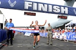 Rachel Harley from Birmingham, Ala., crosses the finish line to become the winner of the 20th U.S. Air Force Marathon women's full marathon division at Wright-Patterson Air Force Base, Ohio, with a time of 2:58:34 (U.S. Air Force photo / Wesley Farnsworth)