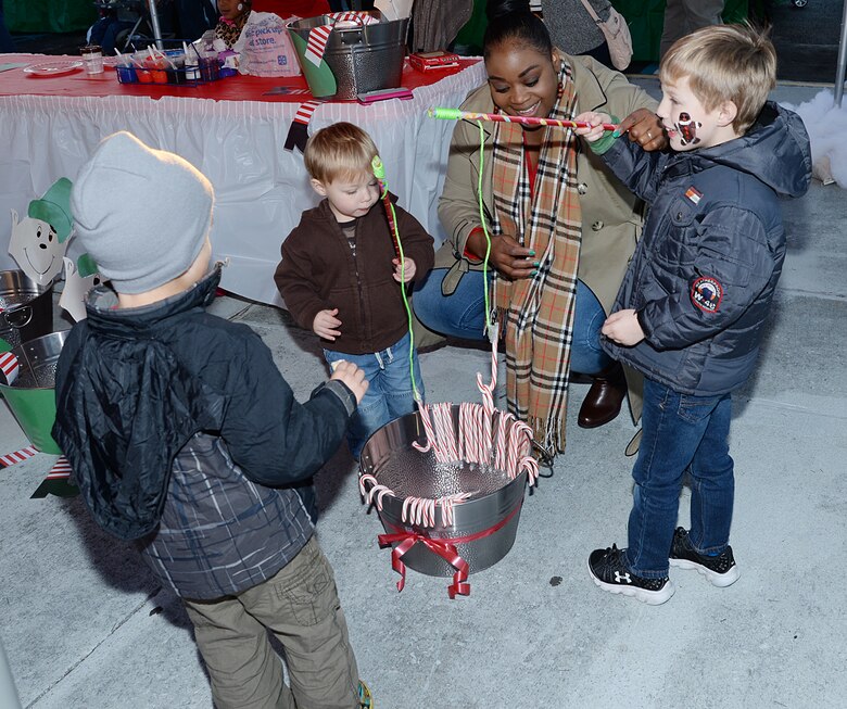 Children play candy cane fishing at a Christmas Tree Lighting Ceremony at Marine Corps Logistics Base Albany, Dec. 9.