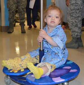 Annabelle Johnson, 19-month-old daughter of Air Force Tech. Sgt. Evan Johnson, enjoys riding on a new IV pole “lily pad” in the pediatric ward at Brooke Army Medical Center at Joint Base San Antonio-Fort Sam Houston Dec. 1.
