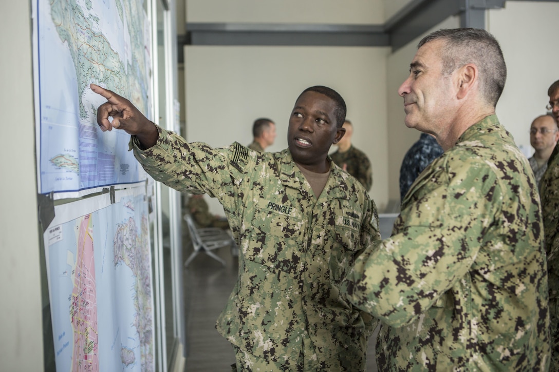 U.S. Navy Rear Adm. Cedric Pringle, left, commander of Joint Task Force Matthew, and Rear Adm. Roy Kitchener, commander of Expeditionary Strike Group 2, visits Joint Task Force Matthew Headquarters to discuss current and future relief efforts in Port-au-Prince, Haiti, Oct. 9, 2016.  JTF Matthew, a U.S. Southern Command-directed team, is comprised of Marines with Special Purpose Marine Air-Ground Task Force - Southern Command and soldiers from Joint Task Force-Bravo’s 1st Battalion, 228th Aviation Regiment, deployed to Port-au-Prince at the request of the Government of Haiti on a mission to provide humanitarian and disaster relief assistance in the aftermath of Hurricane Matthew. (U.S. Marine Corps photo by Cpl. Kimberly Aguirre)