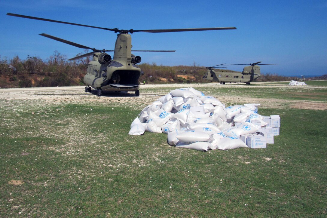 U.S. Marines with Special Purpose Marine Air-Ground Task Force – Southern Command, soldiers from Joint Task Force-Bravo’s 1st Battalion, 228th Aviation Regiment and representatives from United States Agency of International Development deliver bags of food to citizens of Jeremie, Haiti, who were affected by Hurricane Matthew Oct. 8, 2016. JTF Matthew is a U.S. Southern Command-directed team deployed to Port-au-Prince at the request of the Government of Haiti, on a mission to provide humanitarian and disaster relief assistance in the aftermath of Hurricane Matthew.