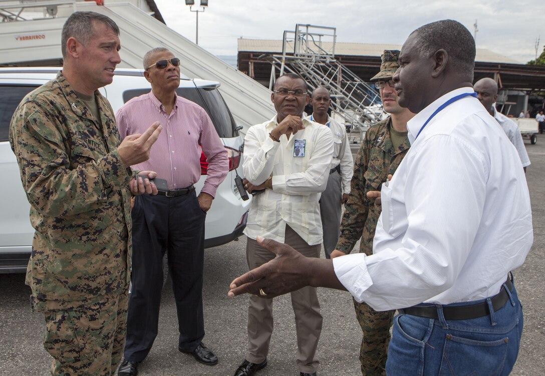 Colonel Thomas Prentice, commanding officer of Special Purpose Marine Air-Ground Task Force – Southern Command, discusses possible staging areas for helicopters that will be utilized during relief operations to provide aid to areas affected by Hurricane Matthew, with Ernst Renaud, director of Toussaint Louverture International Airport at Port-au-Prince, Haiti, Oct. 6, 2016. Having staging areas at the airport are critical in providing timely relief to the affected areas of Haiti. SPMAGTF-SC Marines and soldiers from Joint Task Force-Bravo’s 1st Battalion, 228th Aviation Regiment are a part of Joint Task Force Matthew, a U.S. Southern Command-directed team deployed to Port-au-Prince at the request of the Government of Haiti, on a mission to provide humanitarian and disaster relief assistance in the aftermath of Hurricane Matthew.