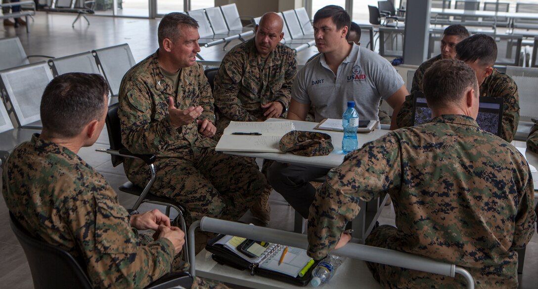 U.S. Marines with Special Purpose Marine Air-Ground Task Force - Southern Command, soldiers from Joint Task Force-Bravo’s 1st Battalion, 228th Aviation Regiment, and a representative from United States Agency for International Development begin planning relief operations at Port-au-Prince, Haiti, Oct. 6, 2016. The Marines and soldiers are a part of Joint Task Force Matthew, a U.S. Southern Command-directed team deployed to Port-au-Prince at the request of the Government of Haiti, on a mission to provide humanitarian and disaster relief assistance in the aftermath of Hurricane Matthew. (U.S. Marine Corps photo by Sgt. Adwin Esters)