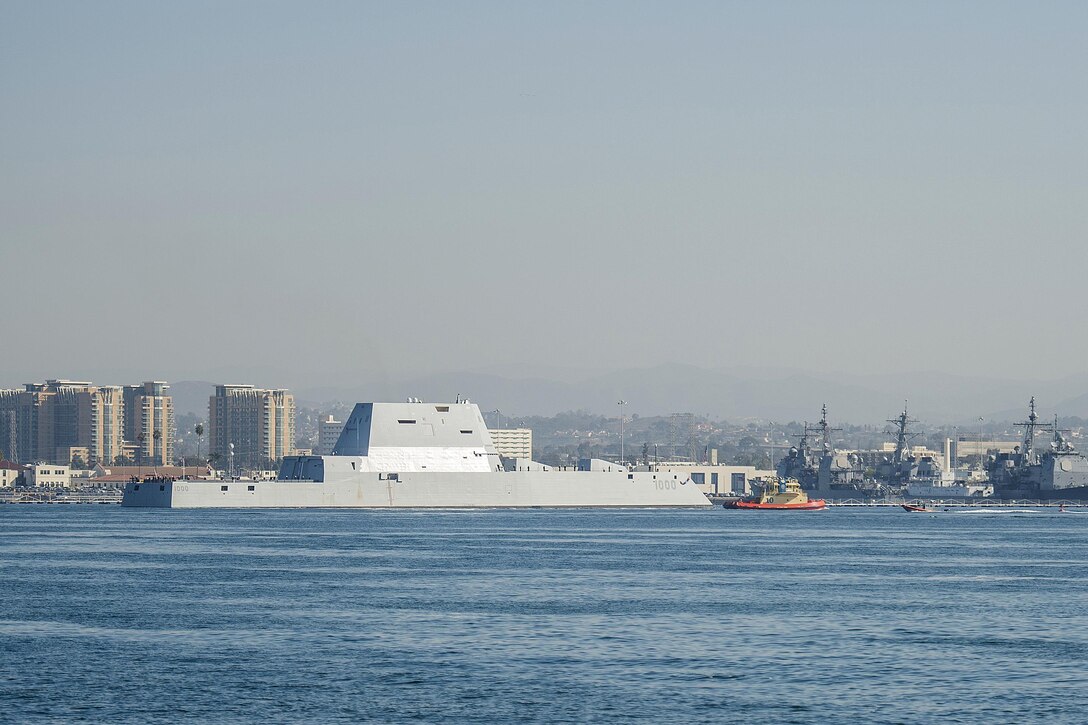 A tugboat escorts the USS Zumwalt to its new home port in San Diego, Dec. 8, 2016. Navy photo by Petty Officer First Class Trevor Welsh