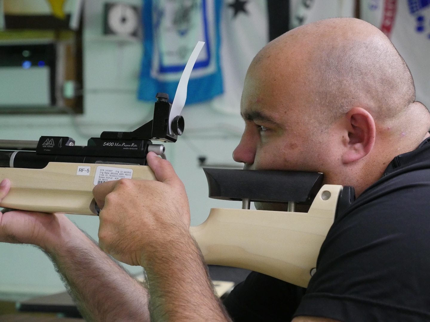 U.S. Army Sgt. David Crook, Bravo Company, Warrior Transition Battalion, Brooke Army Medical Center, is ready to squeeze the trigger during an air rifle training session at Central Catholic High School, San Antonio, Texas, Nov. 10, 2016. The training is part of the WTB’s adaptive reconditioning program.  (U.S. Army photo by Robert A. Whetstone/Released)