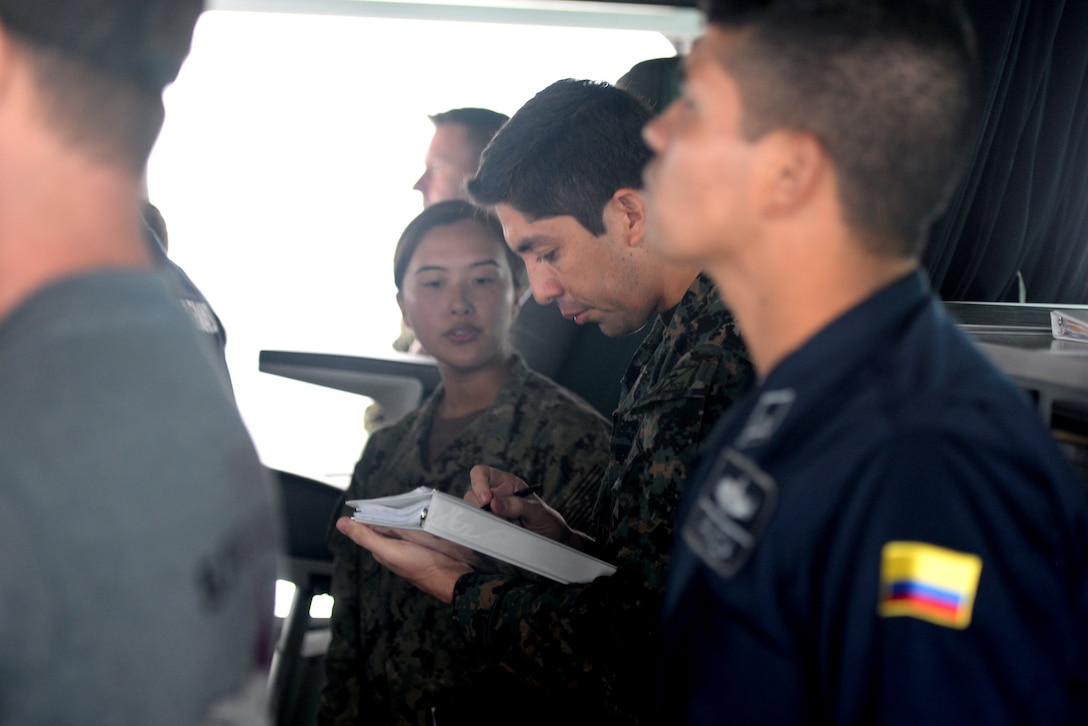 GULF OF PANAMA (Sept. 23, 2016) - Lt. Eder Suclla, of Peru, coordinates 18 ships from 11 countries, forming around USNS Spearhead (T-EPF 1), as part of a multinational ship movement exercise. UNITAS is an annual multi-national exercise that focuses on strengthening our existing regional partnerships and encourages establishing new relationships through the exchange of maritime mission-focused knowledge and expertise throughout the exercise. (U.S. Navy Photo by Mass Communication Specialist 1st Class Jacob Sippel/RELEASED)