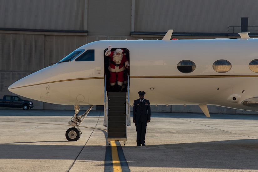 Santa Claus disembarks a C-20B at the 2016 Parents and Children Fighting Cancer Christmas Party at Joint Base Andrews, Md., Dec. 10, 2016. Santa and Mrs. Claus delivered gifts to the families in attendance at the party.  The JBA Fisher House has hosted the annual event since 1987. (U.S. Air Force photo by Airman 1st Class Rustie Kramer)
