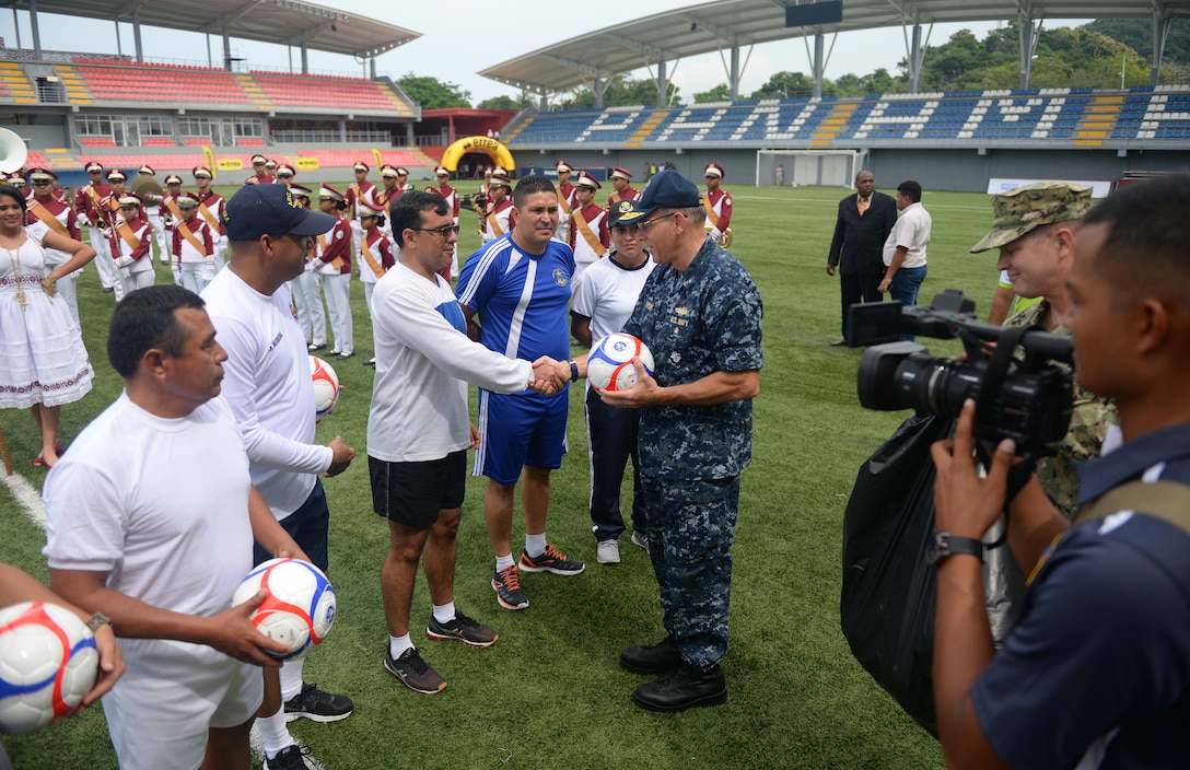 PANAMA CITY, Panama (Sept. 20, 2016) - Rear Adm. Robert Greene, Deputy Commander, U.S. Naval Forces Southern Command, gives UNITAS partner nations gift of soccer balls during a day of sports at the Estadio Maracaná de Panamá soccer stadium. UNITAS is an annual multi-national exercise that focuses on strengthening our existing regional partnerships and encourages establishing new relationships through the exchange of maritime mission-focused knowledge and expertise throughout the exercise. (U.S. Navy Photo by Mass Communication Specialist 1st Class Jacob Sippel/RELEASED)