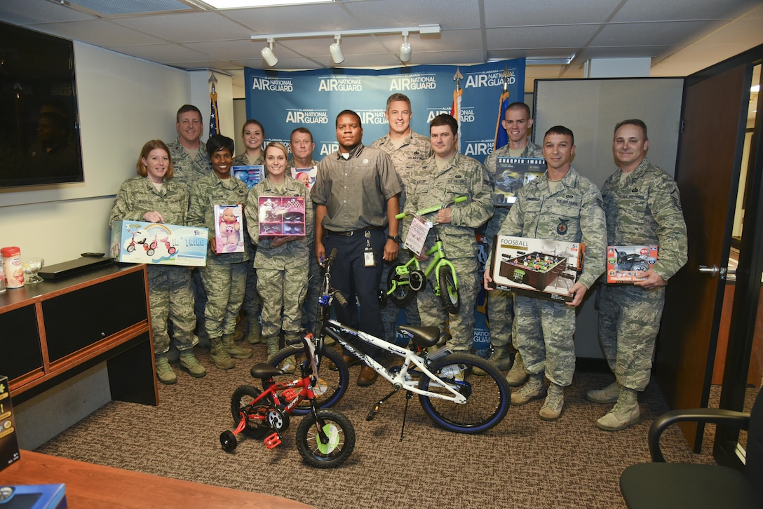 A local AT&T office delivers toys to the 117th Air Refuelling Wing, Birmingham, Alabama December 13, 2016. (U.S. Air National Guard photo by: Senior Master Sgt. Ken Johnson)