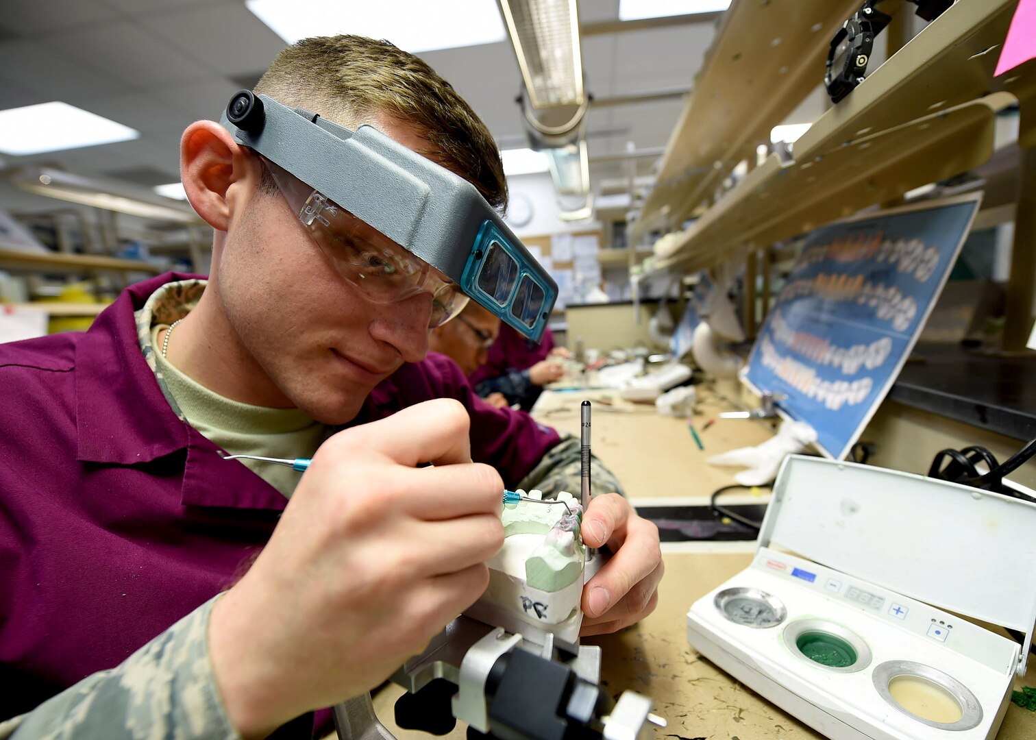 Airman Logan Encinas, a dental laboratory apprentice course trainee, practices fabricating a metal restoration at the Medical Education and Training Campus on Joint Base San Antonio-Fort Sam Houston, Oct. 20, 2016. During the 6-month course, trainees will learn and practice the concepts and skills necessary to become a fully-qualified dental laboratory technician. (U.S. Air Force photo/Staff Sgt. Jerilyn Quintanilla)