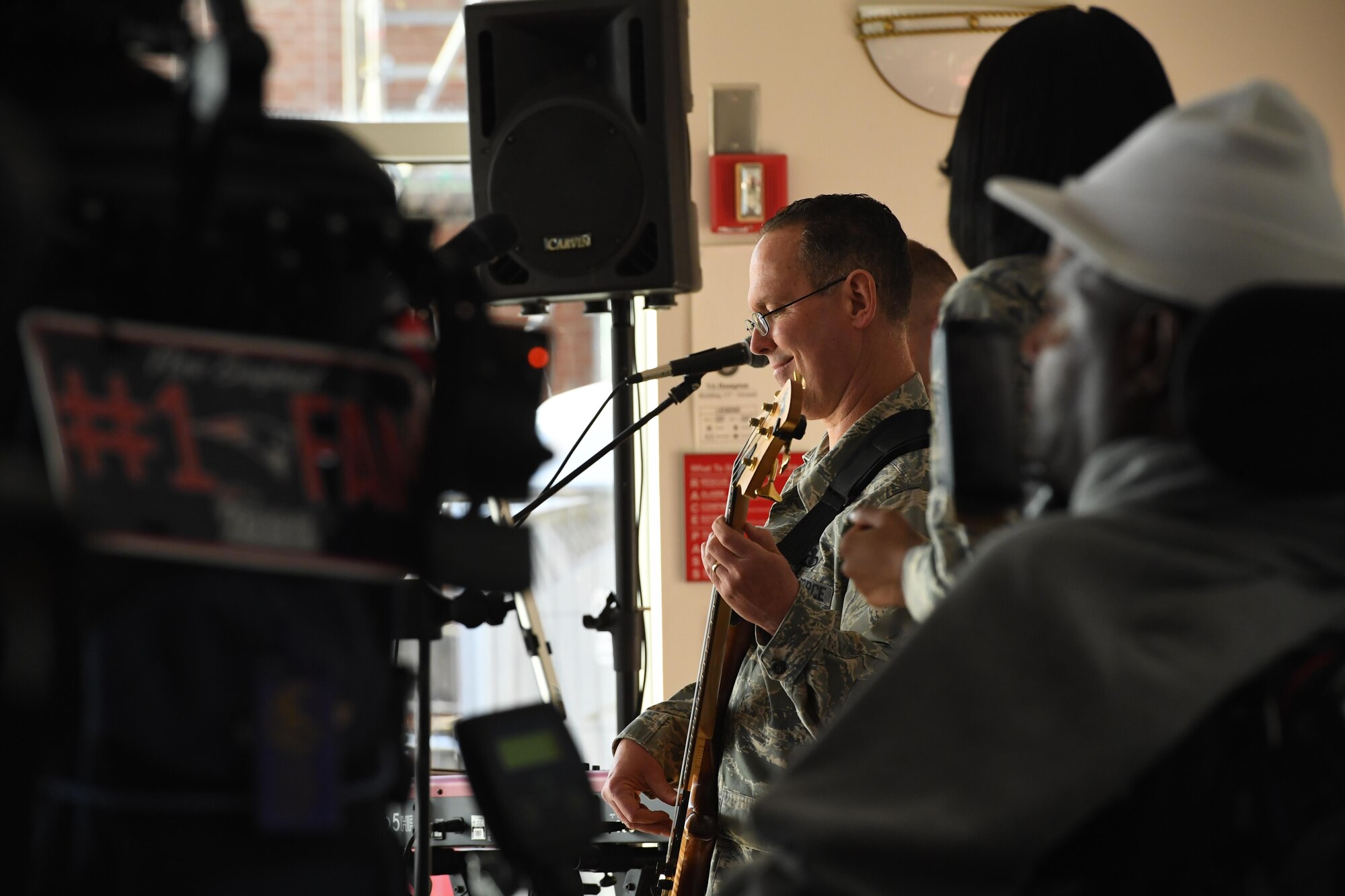 Master Sgt. Kenny Maurais, a bassist with the U.S. Air Force Heritage of America Band, entertains the crowd during a holiday concert at the Hampton Veteran’s Medical Center, Jan. 7, 2016. The Blue Aces have deployed multiple times to Southwest Asia, supporting U.S. and coalition troops, while building international friendships. (U.S. Air Force photo by Staff Sgt. Nick Wilson)