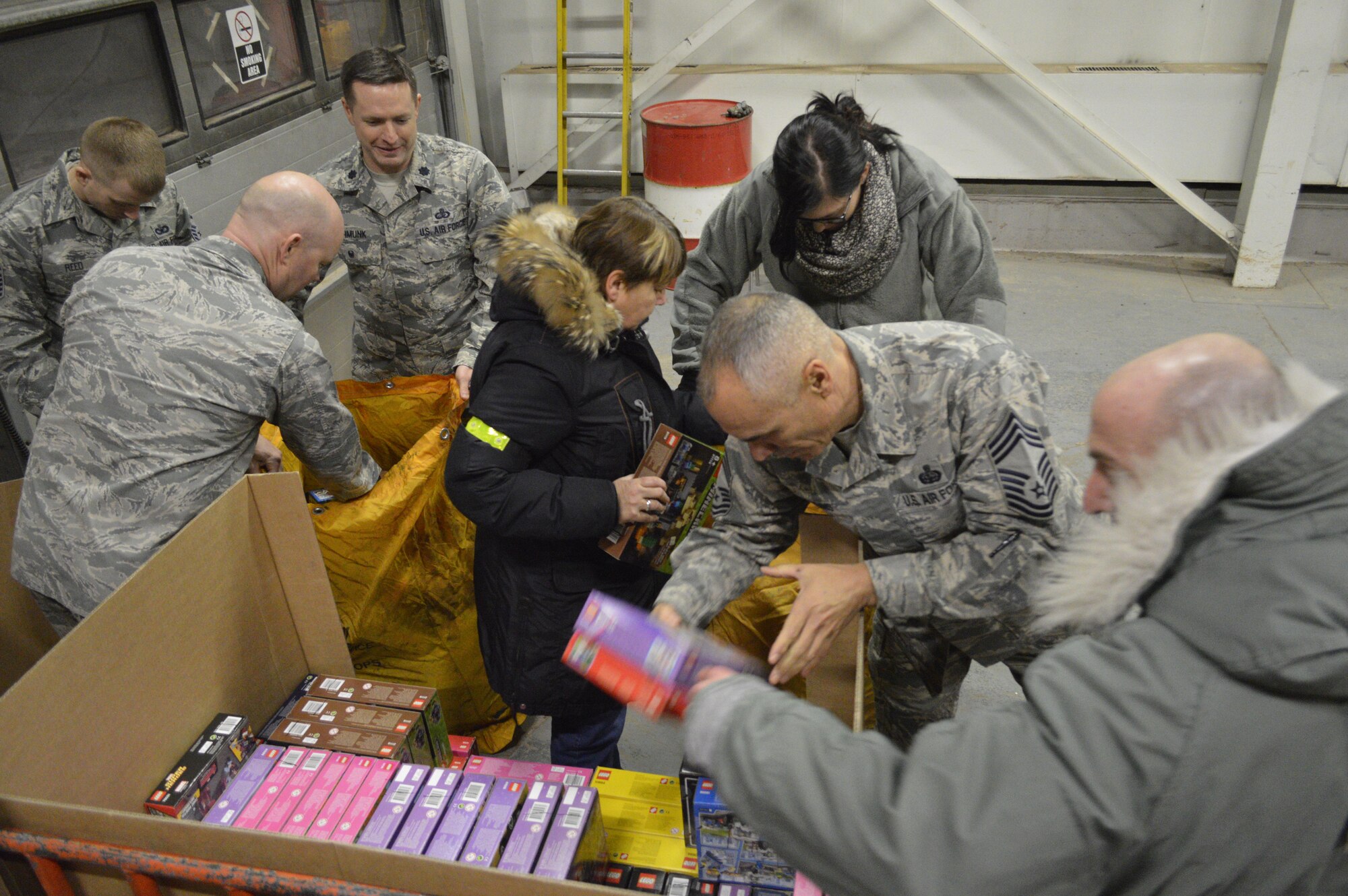 THULE AIR BASE, Greenland—Volunteers Thule Air Base, Greenland, sort toys for local village children Dec. 6, 2016, as part of Operation Julemand. The 821st Air Base Group at Thule AB is a geographically separated unit from the 21st Space Wing at Peterson Air Force Base, Colo. Starting in 1959, Operation Julemand allowed personnel at Thule AB to give gifts to the children who live in four local Greenlandic villages: Qaanaq, Savissivik, Siorapaluk and Qeqertat. (Courtesy photo)