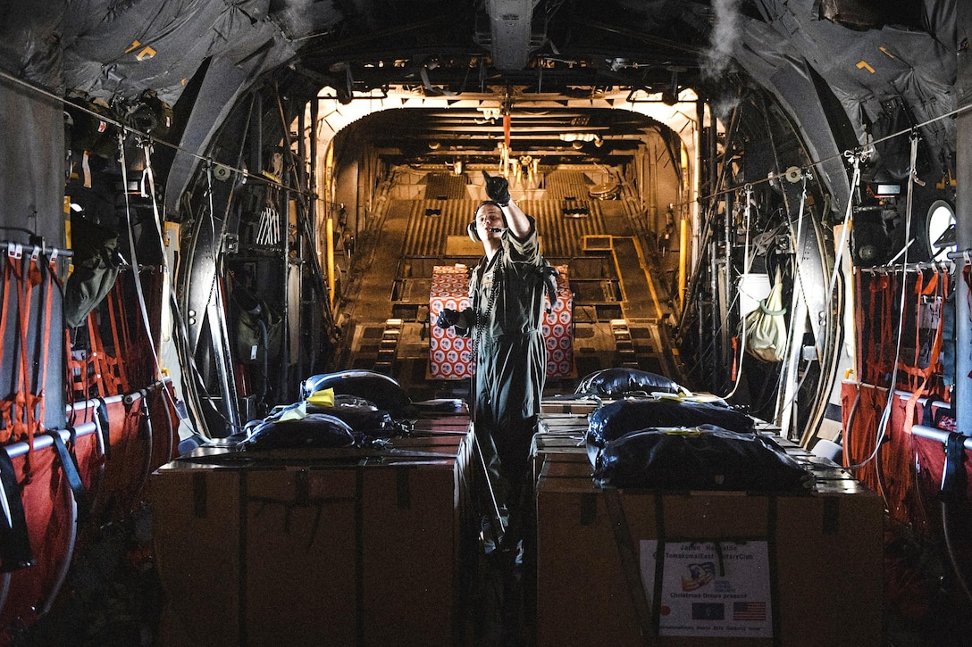 Air Force Staff Sgt. Andrew Thompson prepares for takeoff in a C-130 Hercules aircraft at Andersen Air Force Base, Guam, during Operation Christmas Drop, Dec. 6, 2016. Thompson is a C-130 Hercules loadmaster assigned to the 36th Airlift Squadron. Air Force photo by Senior Airman Delano Scott