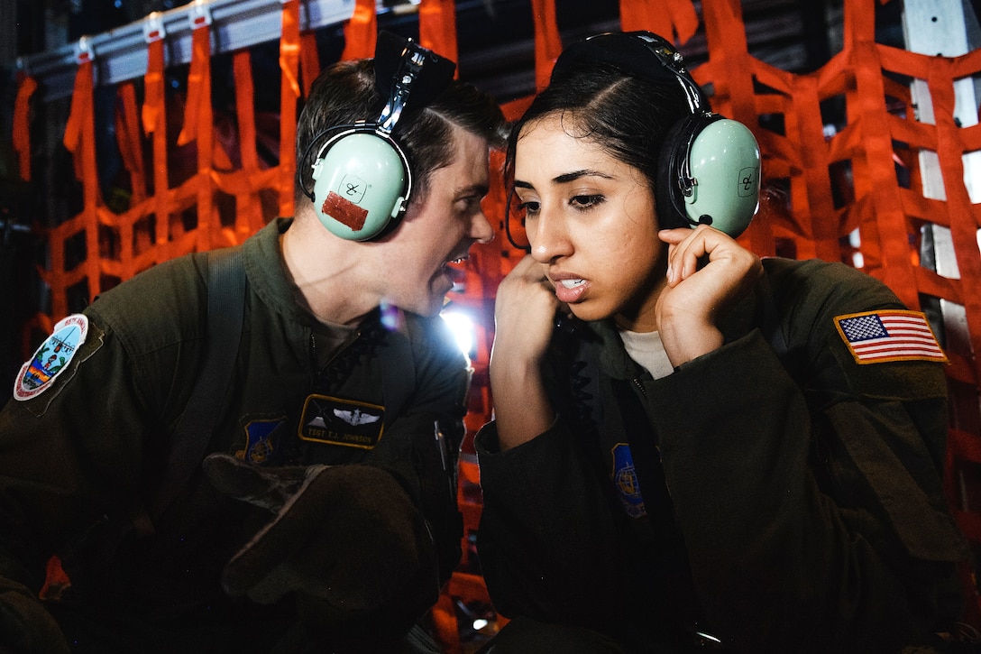 Air Force airmen discuss mission details during Operation Christmas Drop over the Micronesian islands, Dec. 6, 2016. Air Force photo by Senior Airman Delano Scott