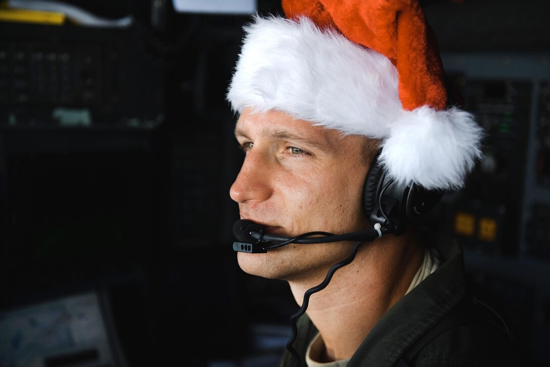 Air Force Capt. Darryl Lawlor observes the skies over the Micronesian islands during Operation Christmas Drop, Dec. 6, 2016. Lawlor is a navigator assigned to the 36th Airlift Squadron. Air Force photo by Senior Airman Delano Scott
