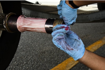 Airman 1st Class Jaime Gurrola, a 386th Expeditionary Aircraft Maintenance Squadron aerospace maintenance journeyman, applies grease to the axle of an EC-130H Compass Call Dec. 5, 2016 at an undisclosed location in Southwest Asia. This was part of preventive maintenance procedures to prepare the EC-130 for its return to Davis-Monthan Air Force Base. (U.S. Air Force photo by Senior Airman Andrew Park)