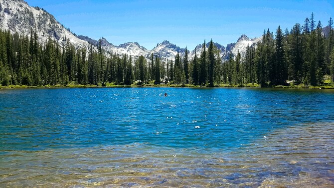 Senior Airman Connor Marth, 366th Fighter Wing Public Affairs photojournalist, swims in Alice Lake in the Sawtooth National Forest, Idaho, July 16th, 2016. Alpine lakes such as Alice Lake are usually fed by springs and large amounts of glacial runoff during the spring and summer months. (U.S. Air Force Photo by Senior Airman Connor J. Marth/Released)