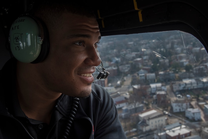 Jason Jordan, World Wrestling Entertainment Superstar, looks out the window of a UH-1N Iroquois helicopter above the National Capital Region of Washington, D.C., Dec. 13, 2016. The 1st Helicopter Squadron provided the Superstars a rare tour of the National Capital Region aboard their aircraft, showing them national monuments like the Washington Monument, U.S. Capital Building and Martin Luther King, Jr. Memorial. (U.S. Air Force photo by Senior Airman Jordyn Fetter)