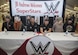 World Wrestling Entertainment Superstars prepare for a signing event at Joint Base Andrews, Md., Dec. 13, 2016. The Superstars spent the morning touring JBA as a way to show their appreciation for the sacrifices military members have made, give back to the community and understand some of the missions that make up the armed forces. (U.S. Air Force photo by Senior Airman Jordyn Fetter)