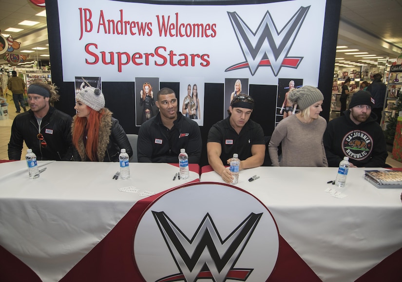 World Wrestling Entertainment Superstars prepare for a signing event at Joint Base Andrews, Md., Dec. 13, 2016. The Superstars spent the morning touring JBA as a way to show their appreciation for the sacrifices military members have made, give back to the community and understand some of the missions that make up the armed forces. (U.S. Air Force photo by Senior Airman Jordyn Fetter)
