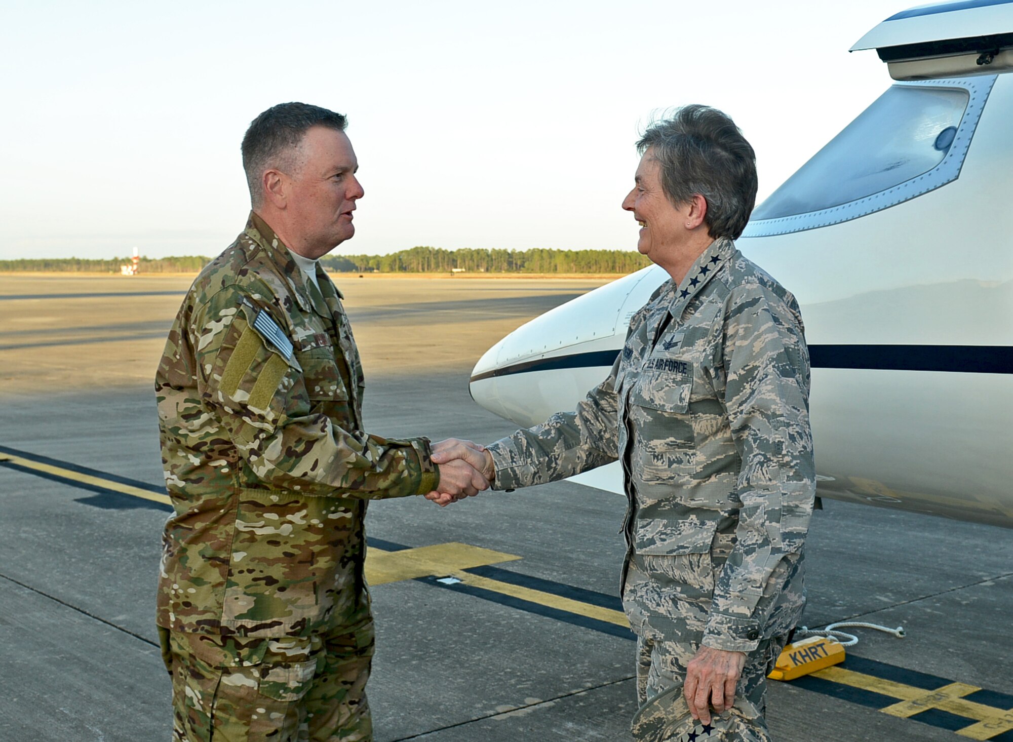 Lt. Gen. Brad Webb, commander of Air Force Special Operations Command, welcomes Gen. Ellen M. Pawlikowski, commander of Air Force Materiel Command, to Hurlburt Field, Fla., Dec. 12, 2016. Webb escorted Pawlikowski on a CV-22 Osprey flight during her visit. (U.S. Air Force photo/Staff Sgt. Melanie Holochwost)
