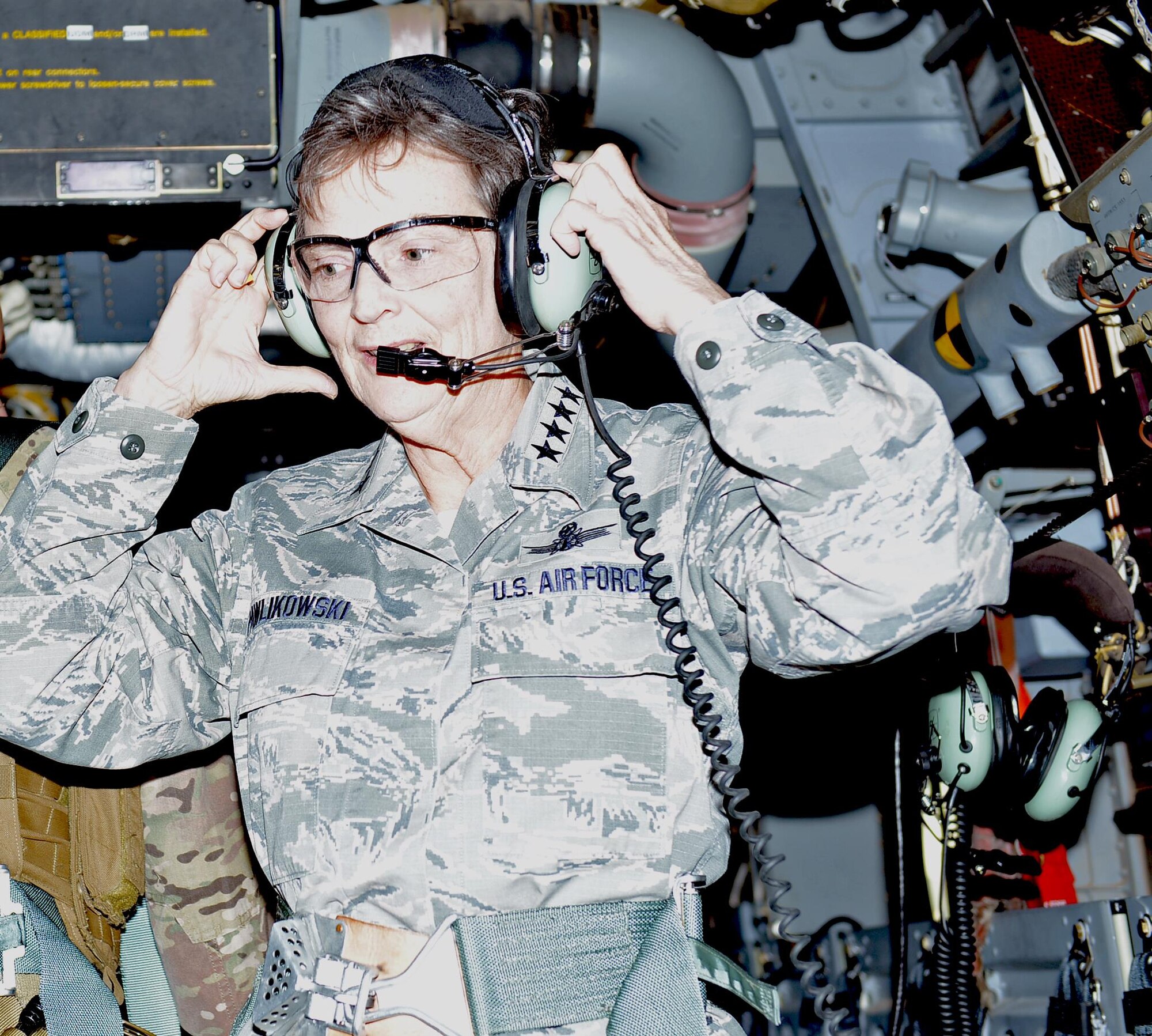 Gen. Ellen M. Pawlikowski, commander of Air Force Materiel Command, puts on a headset prior to a CV-22 Osprey flight at Hurlburt Field, Fla., Dec. 12, 2016. (U.S. Air Force photo/Staff Sgt. Melanie Holochwost)