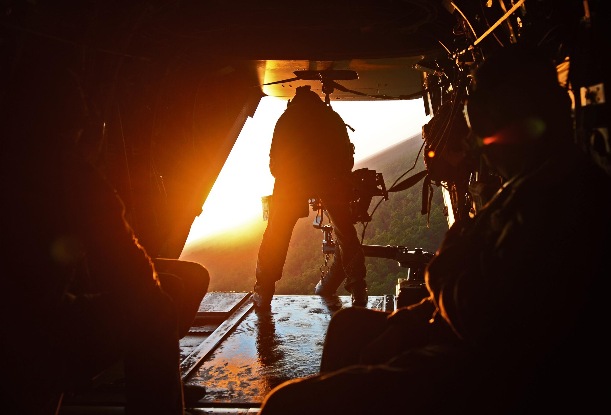 A special mission aviator at the 8th Special Operations Squadron mans the .50 caliber gun on a CV-22 Osprey near Hurlburt Field, Fla., Dec. 12, 2016. Lt. Geb. Brad Webb, commander of Air Force Special Operations Command escorted Gen. Ellen M. Pawlikowski, commander of Air Force Materiel Command, on a CV-22 Osprey flight during her visit. (U.S. Air Force photo/Staff Sgt. Melanie Holochwost)